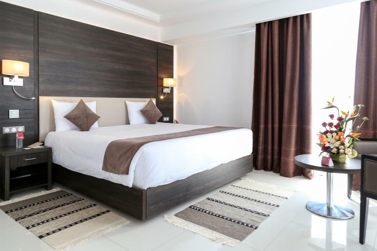 فنادق موفنبيك سفاكس صفاقس‎ المظهر الخارجي الصورة A bedroom in a hotel