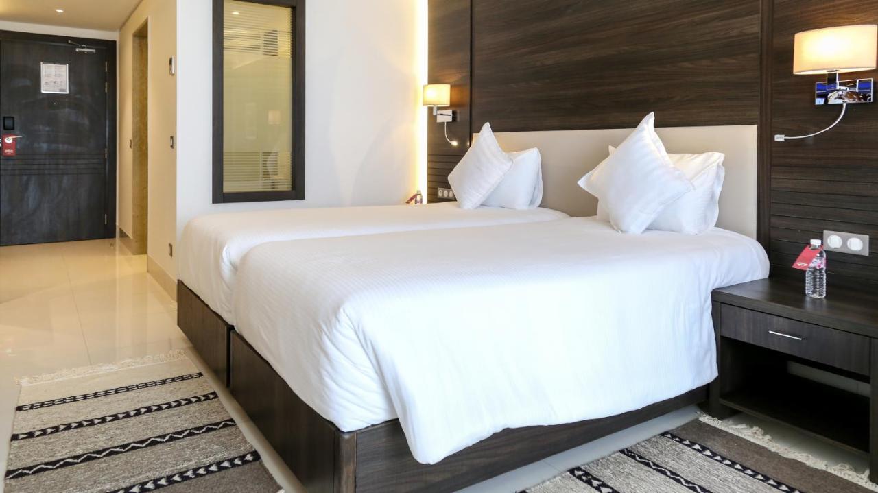 فنادق موفنبيك سفاكس صفاقس‎ المظهر الخارجي الصورة A bedroom at the hotel